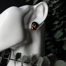 Load image into Gallery viewer, Copper and Black Skull Studs

