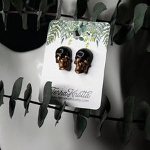 Load image into Gallery viewer, Copper and Black Skull Studs
